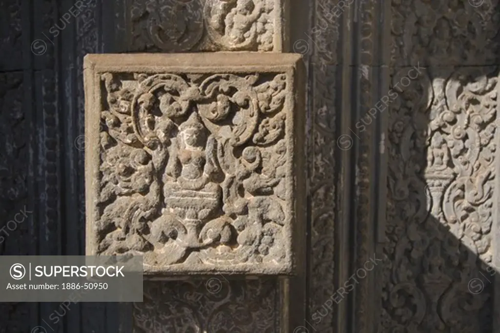 Detail of bas relief door with deity on a Hindu temple at East Mebon, built by Rajendravarman in the10th century - Angkor Wat, Siem Reap, Cambodia
