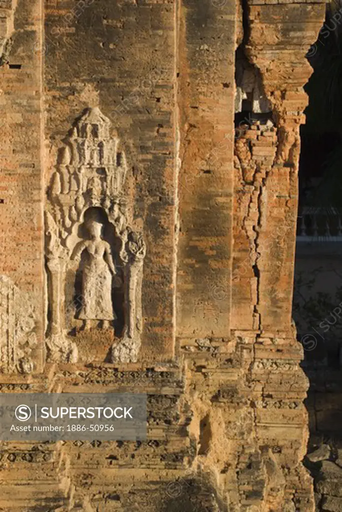 Sandstone Apsara on brick tower at Bakong, the 9th century state Hindu temple of Indravarman I in the Roluos District of Angkor Wat - Cambodia
