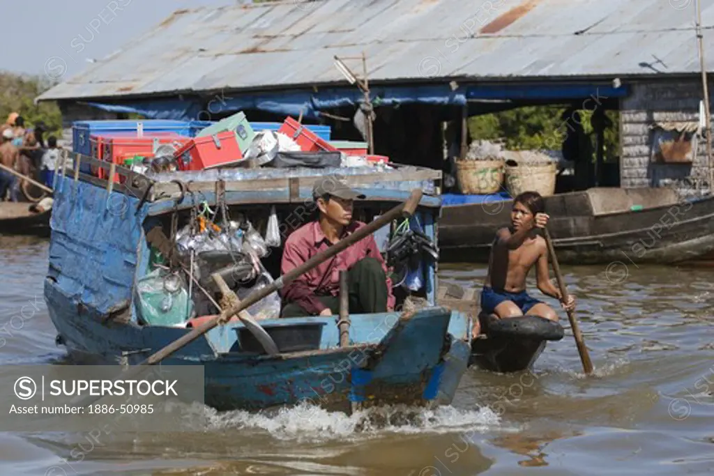 Merchant boat in the Vietnamese floating village of Chong Kneas on lake Tonle Sap - Siem Reap, Cambodia