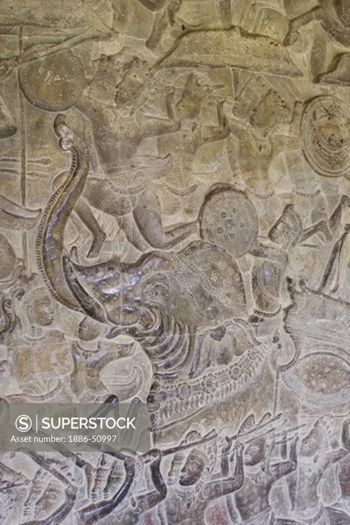 Stone carved bas relief of Kauravas warriors & elephant in the south west corner pavilion at Angkor Wat, built in the 11th century by Suryavarman the 2nd,  -  Cambodia