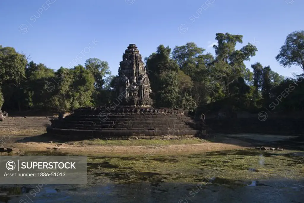 Central pond and temple of Neak Pean built by Jayavarman VII in the 12th century - Angkor Wat, Siem Reap, Cambodia