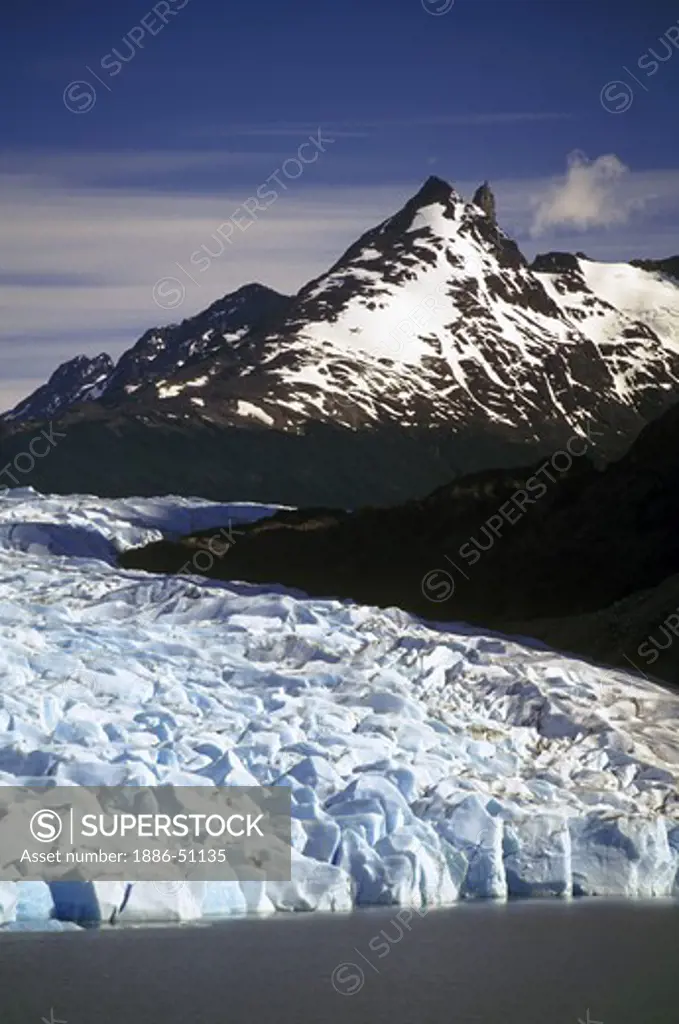 The massive wall of ice that is GREY GLACIER ends at GREY LAKE in TORRES DEL PAINE NATIONAL PARK - PATAGONIA, CHILE