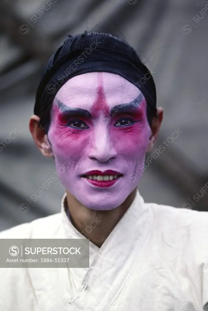 CHINESE OPERA ACTOR with makeup but no costume on before a performance in the farming town of DALI - YUNNAN, CHINA