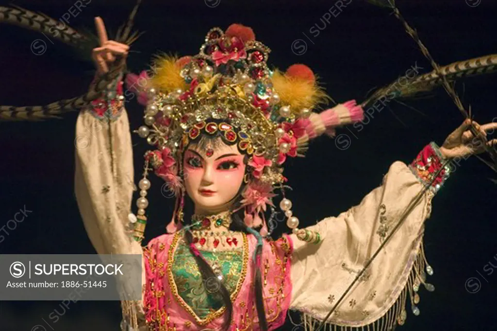 Female Puppet with beautiful feather headress in a traditional Chinese Puppet Show - Chengdu, China in Sichuan Province