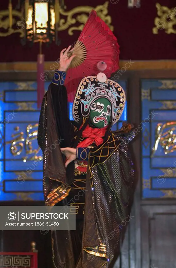 Mask changing puppet with fan in a traditional Chinese Puppet Show drama - Chengdu, China in Sichuan Province