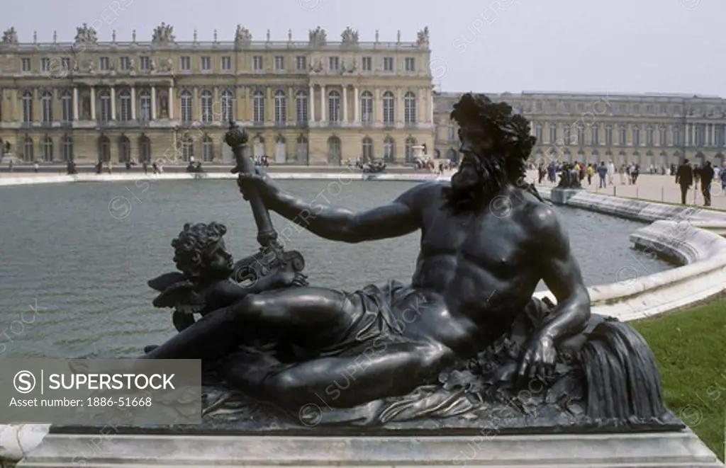 BRONZE STATUE of GREEK GOD and CHERUBS and a FOUNTAIN of VERSAILLES PALACE, built for LOUIS XIV, the SUN KING - VERSAILLES, FRANCE