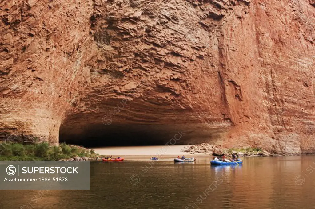 RAFTS approach REDWALL CAVERN, a large cave found at mile 33 along the Colorado River - GRAND CANYON,  ARIZONA