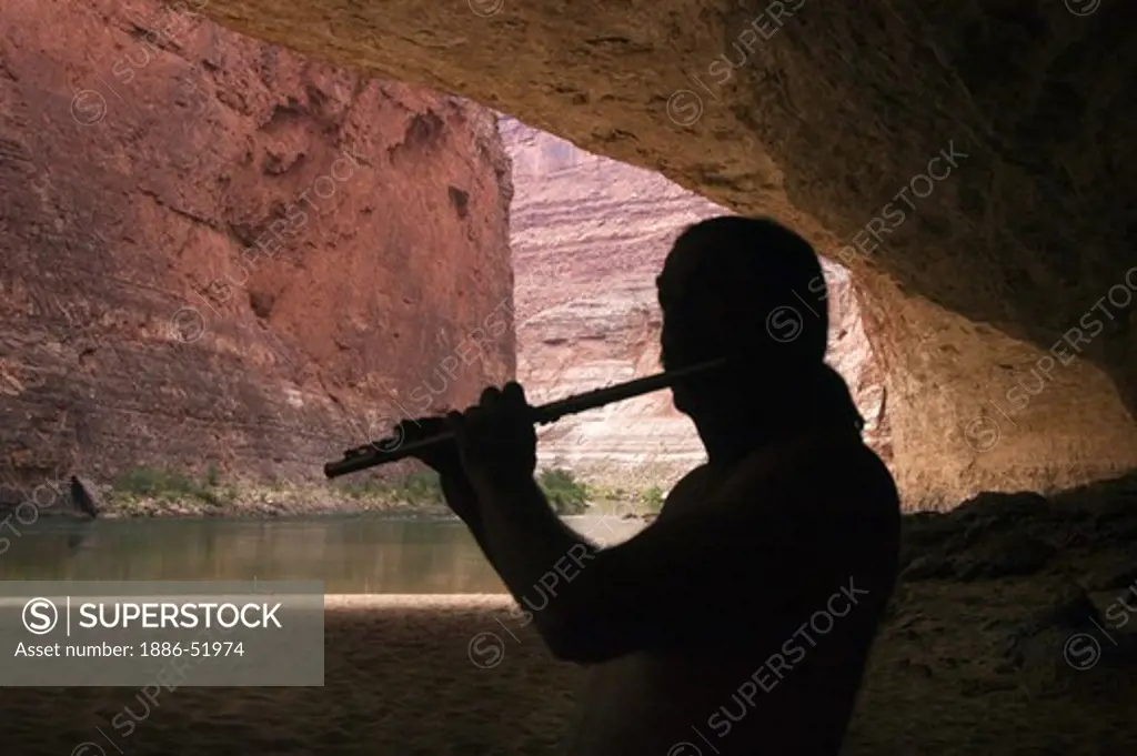 AMOS LOVELL plays flute in REDWALL CAVERN, a very large cave found at mile 33 along the Colorado River - GRAND CANYON,  ARIZONA