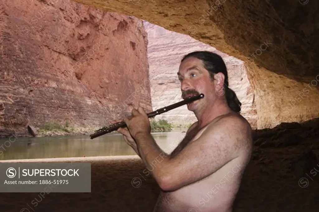 AMOS LOVELL plays flute in REDWALL CAVERN, a very large cave found at mile 33 along the Colorado River - GRAND CANYON,  ARIZONA