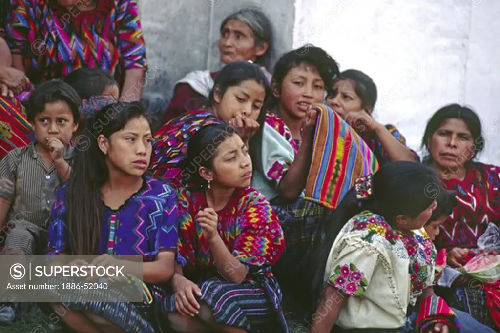 INDIANS in handwoven traditional dress outside EL CALVARIO CHURCH - CHICHICASTENANGO, GUATEMALA
