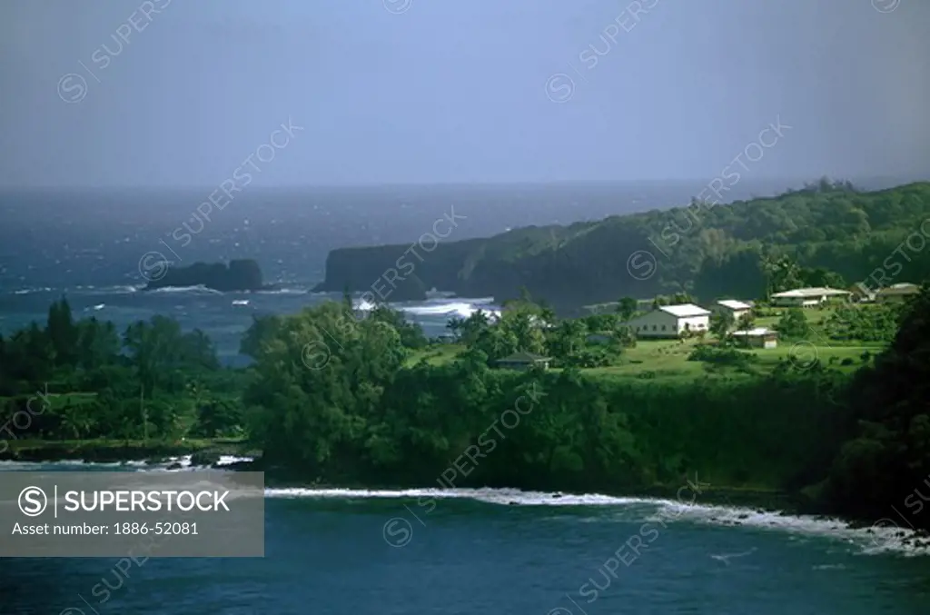 The PACIFIC OCEAN meets the Hawaiian shore at KEANEA POINT and village on the road to HANA - MAUI, HAWAII