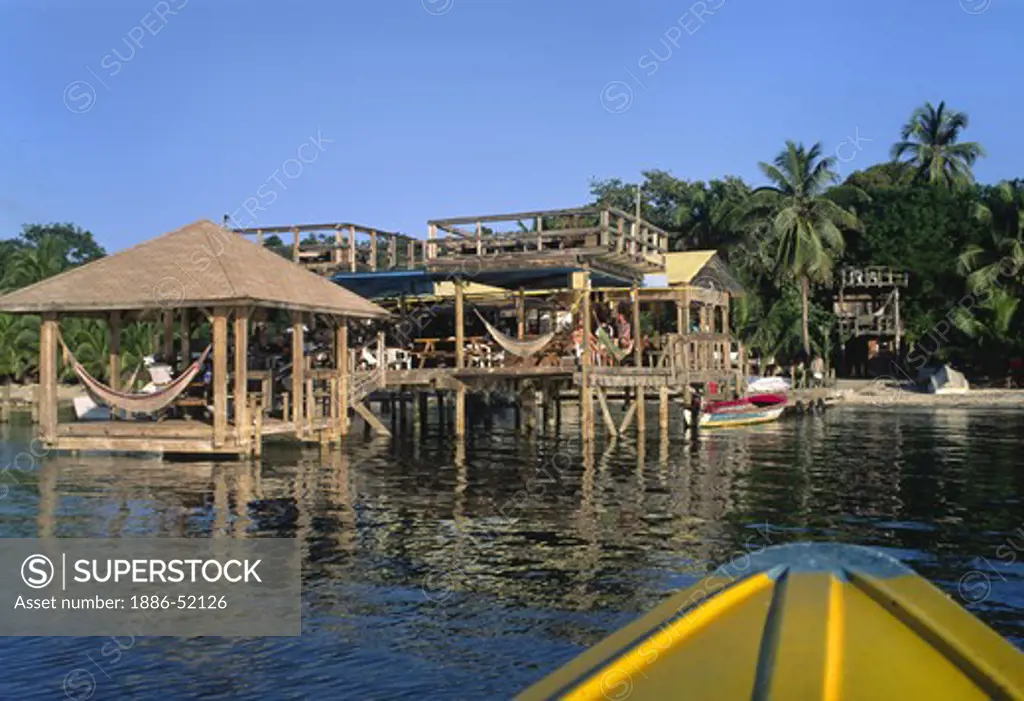 FOSTER'S RESTAURANT in PARADISE of PALM TREES and CARIBBEAN SEA of WEST END BAY - BAY ISLANDS, ROATAN, HONDURAS