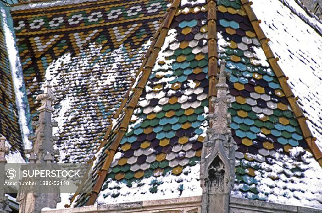 Snow encrusted TILE ROOF of MATTHIAS CHURCH (rebuilt in 1896) & situated on CASTLE HILL  - BUDAPEST, HUNGARY