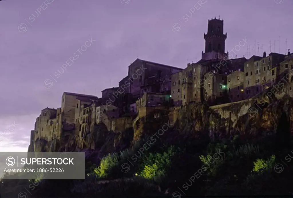 Night settles over PITIGLIANO, one of the classic MIDIEVAL HILL TOWNS of TUSCANY, ITALY