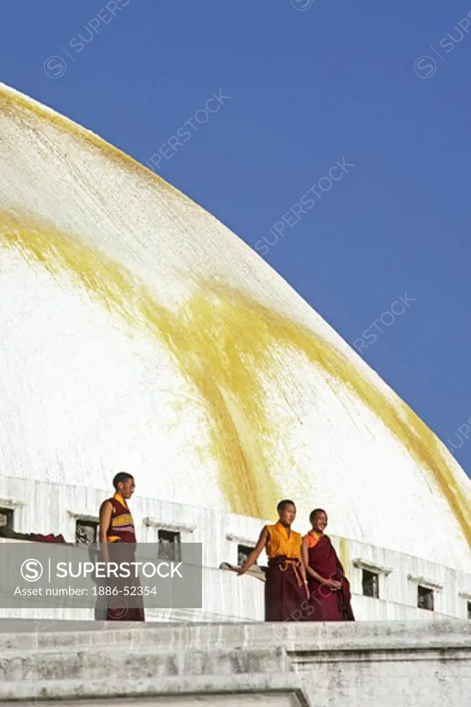BUDDHIST MONKS at BODHANATH STUPA - KATHAMANDU, NEPAL