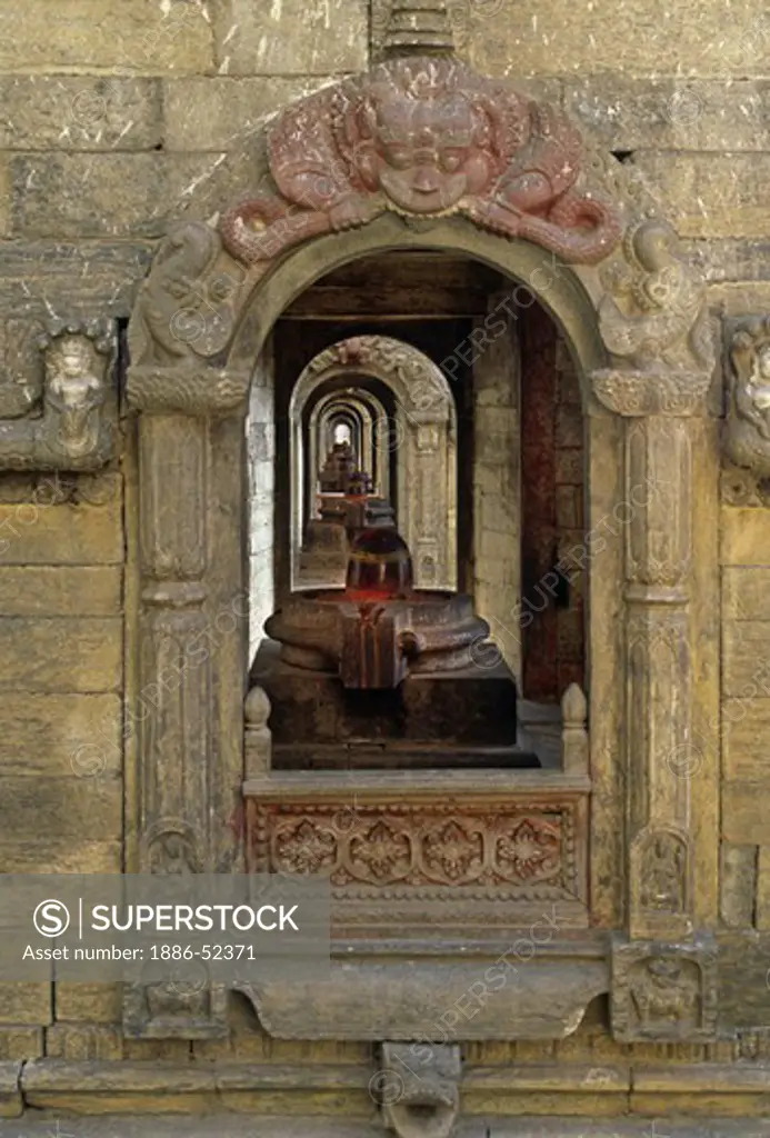A SHIVA LINGAM resides in one of the many HINDU TEMPLES at the PASHUPATINATH TEMPLE COMPLEX - KATHAMANDU, NEPAL