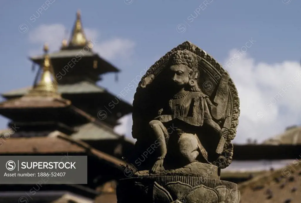 A stone statue of HANUMAN atop a pillar in KATHAMNDU'S DURBAR SQUARE - NEPAL