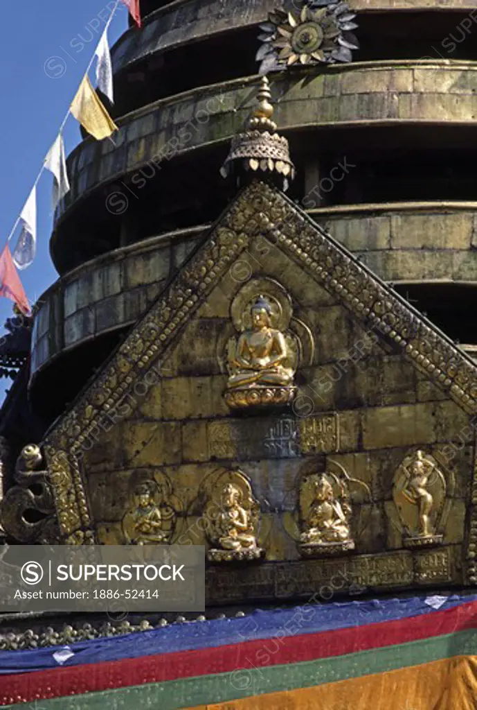 Buddhist PRAYER FLAGS fly atop SWAYAMBUNATH STUPA, a Hindu/Buddhist shrine - KATHAMANDU, NEPAL