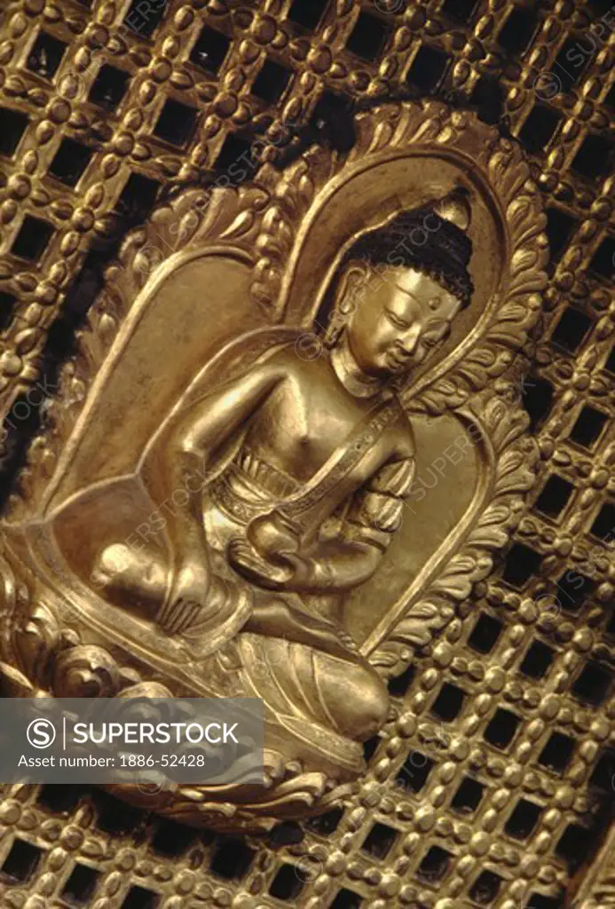 Gold gilded BUDDHA adorns a temple at SWAYAMBUNATH - KATHAMANDU, NEPAL