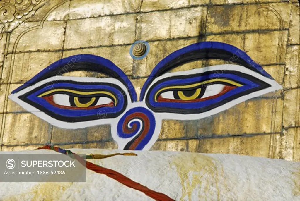 The all seeing EYES OF THE BUDDHA look out from one of the 4 sides of SWAYAMBUNATH STUPA - KATHAMANDU, NEPAL