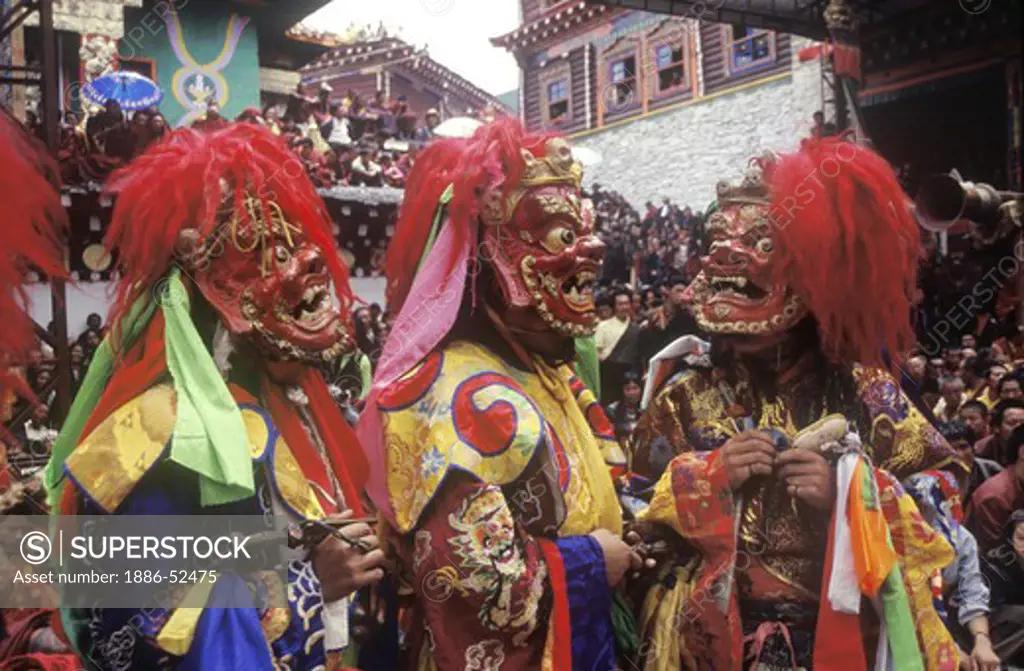 Masked dancers (protector deity) at the Monlam Chenmo or Cham Dances, Katok Monastery - Kham, (Tibet), Sichuan, China