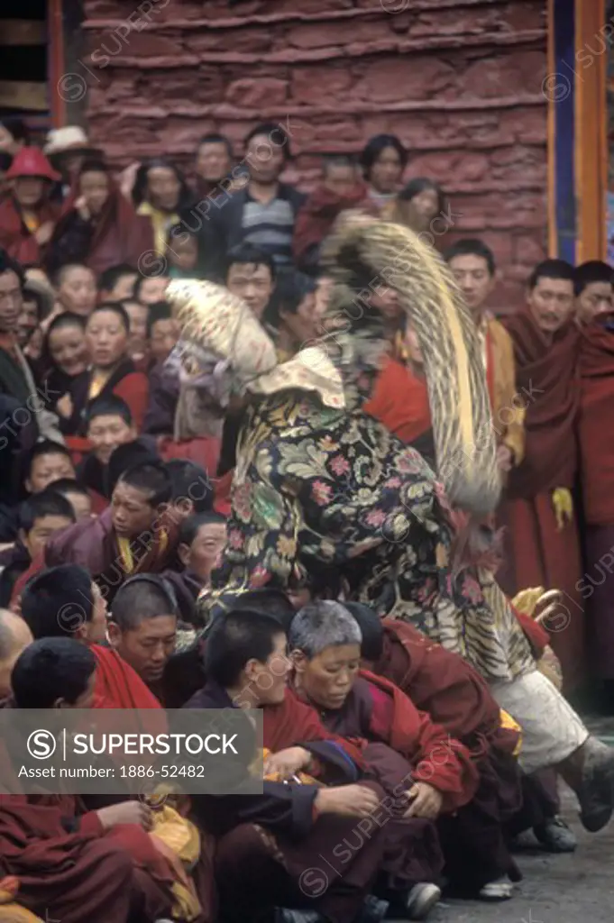 Disciplinarian Arhat & clown at the Cham Dances, Katok Dorjeden Monastery - Kham, (E. Tibet), Sichuan Province, China