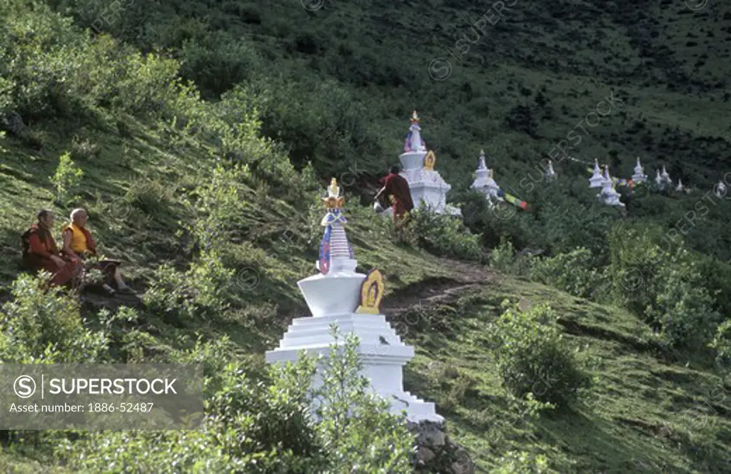 Stupas & monks above the Tibetan Buddhist monastery of Katok Dorjeden - Kham, (E. Tibet), Sichuan Province, China