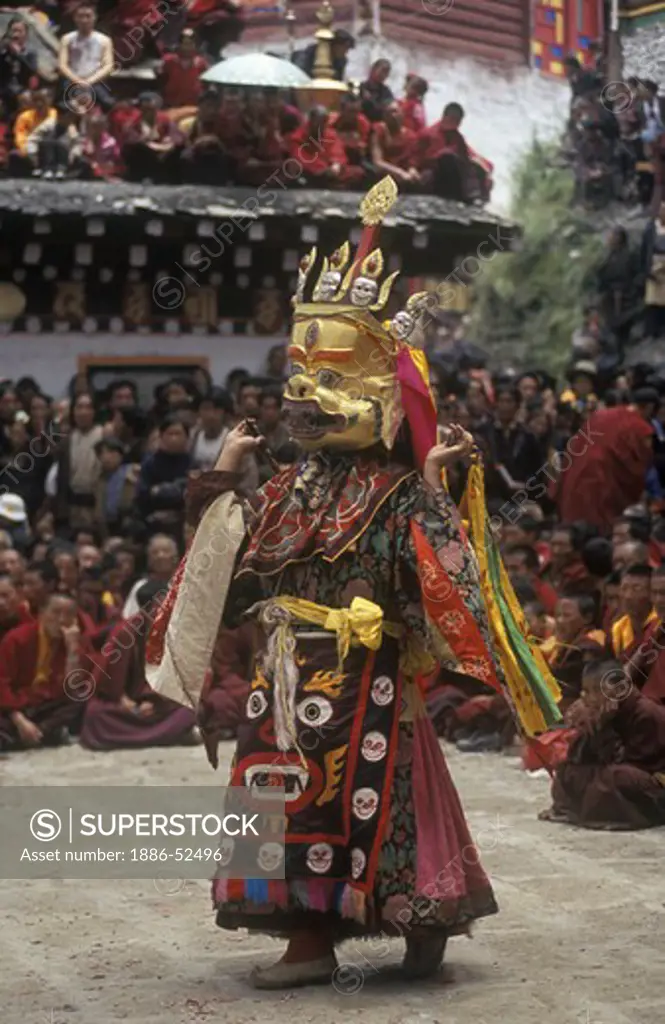 A Monk dance with ribbons representing deity powers at the Monlam Chenmo, Katok Monastery - Kham, (Tibet), Sichuan, China