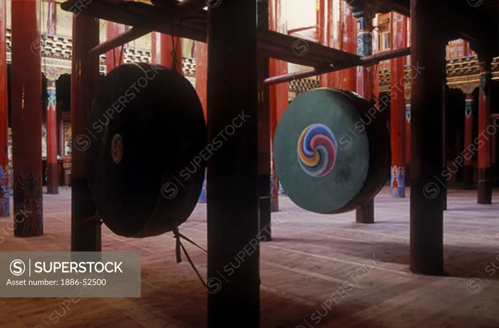 Pillars & drums in the reconstructed Derge Gonchen Monastery in Derge town - Kham, (E. Tibet), Sichuan Province, China