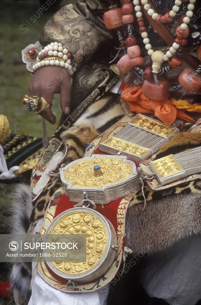 Male Khampa wears leopard skin, coral, zee stones & gold gau boxes at the Litang Horse Festival - Sichuan Province, China, (Tibet)