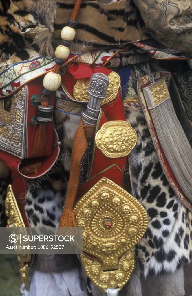 Male Khampa wears leopard skin, knife & gold as wealth display at the Litang Horse Festival - Sichuan Province, China, (Tibet)