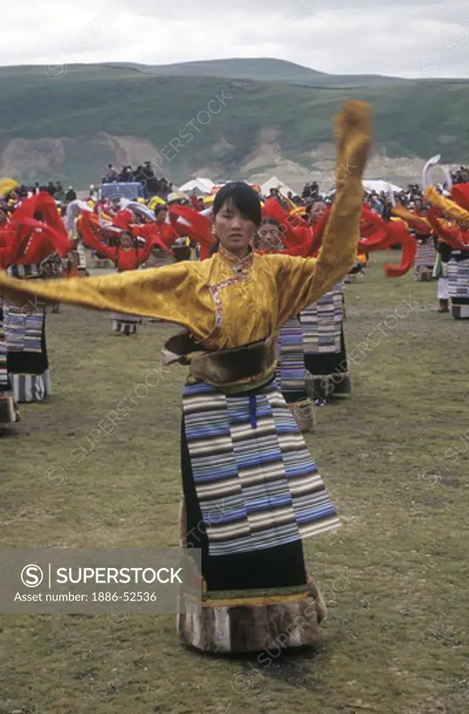 Dance troops preform at the Litang Horse Festival, representing various regions of Kham - Sichuan Province, China, (Tibet)