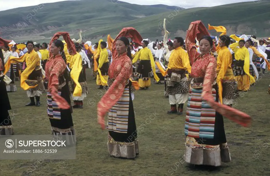 Dance troops preform at the Litang Horse Festival, representing various regions of Kham - Sichuan Province, China, (Tibet)