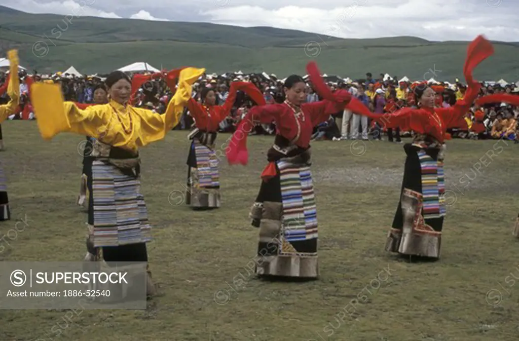 Dance troops preform at the Litang Horse Festival, representing various regions of Kham - Sichuan Province, China, (Tibet)