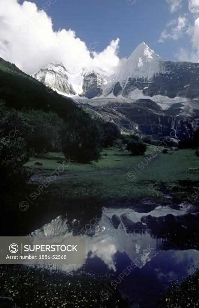 Reflection of Mount Chakna Dorje (5958 M),  Nyinteng (Yading) Nature Reserve, Kham - Sichuan Province, China, (Tibet)