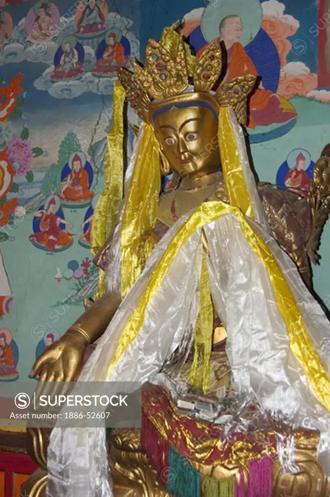 Statue of Tibetan Buddha in bestowing mudra (hand gesture) with katoks, Tagong  Monastery (Lhagang Gompa) - Kham (E. Tibet), Sichuan Province, China