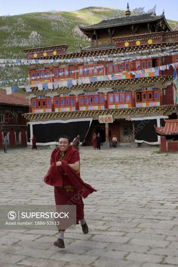 Monk in the inner courtyard of Tagong (Lhagong) Monastery - Kham (Eastern Tibet), Sichuan Province, China