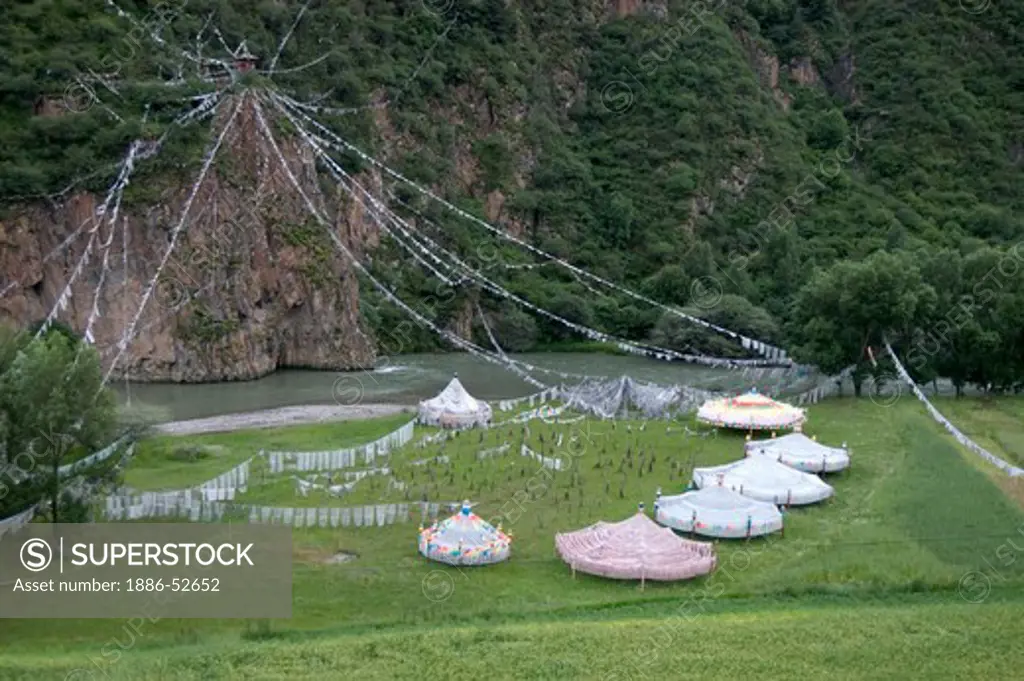 Prayer flags in the shape of auspicious umbrellas bless the world in Derge county - Kham (E. Tibet), Sichuan Province, China