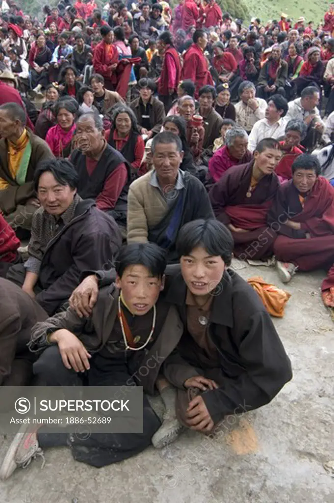 Boys & crowd at the Monlam Chenmo masked dances, Katok Dorjeden Monastery - Kham, (eastern Tibet), Sichuan Province, China