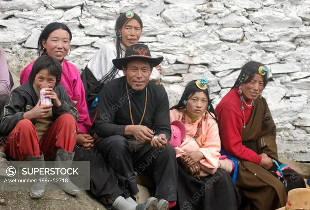 Khampa men and women watch the Monlam Chenmo masked dances, Katok Dorjeden Monastery - Kham, (Tibet), Sichuan, China