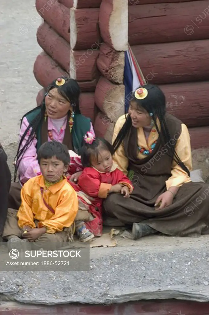 Women & children at the Monlam Chenmo masked dances, Katok Dorjeden Monastery - Kham, (eastern, Tibet), Sichuan, China