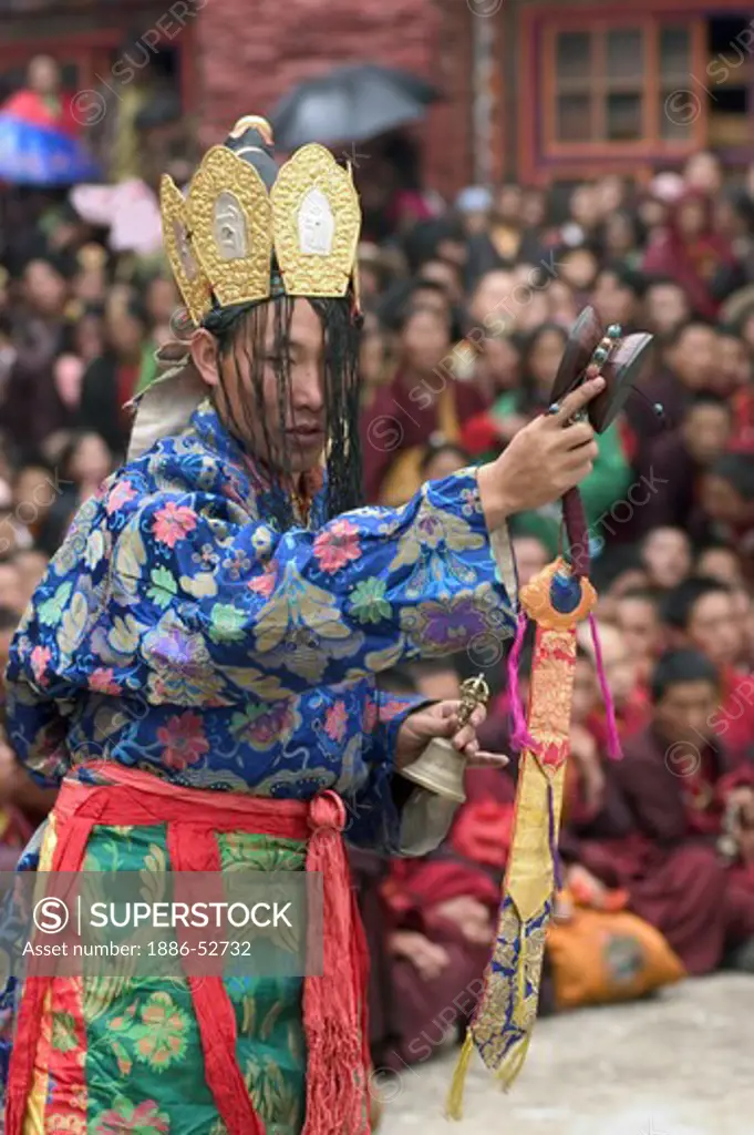 Nyingma monk with damaru drum & bell at the Cham dances, Katok Dorjeden Monastery - Kham, (Tibet), Sichuan Province, China