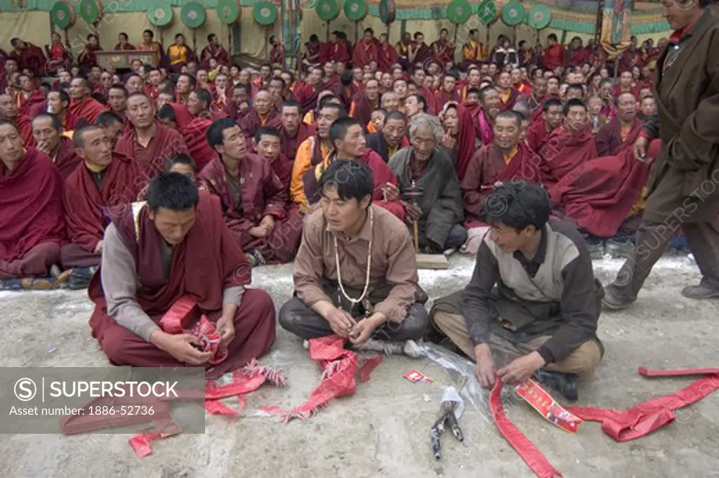 Firecrackers are used at the Cham dances, Katok Monastery - Kham, (Tibet), Sichuan Province, China