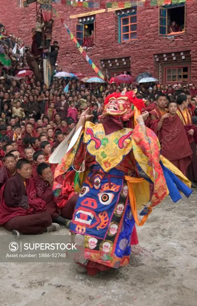 Masked dancer tames demons & negativity  at the Monlam Chenpo, Katok Dorjeden Monastery - Kham, (Tibet), Sichuan, China