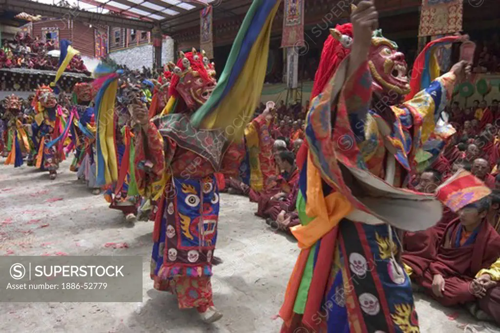 Masked dancers tame demons & negativity  at the Monlam Chenpo, Katok Dorjeden Monastery - Kham, (Tibet), Sichuan, China