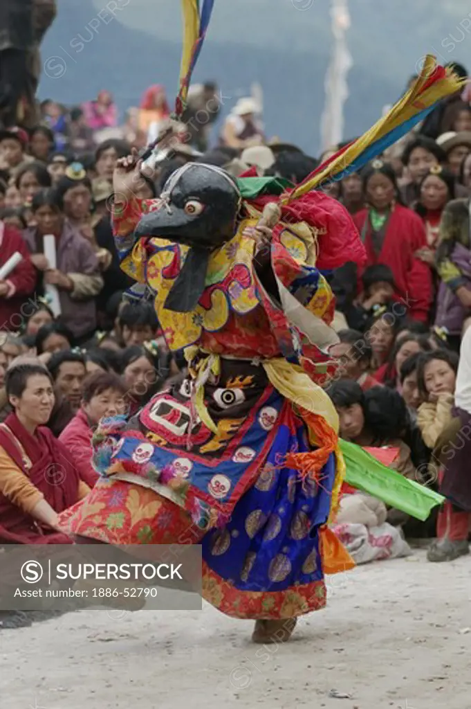 Crow dances with owl to show enemys at peace at the Monlam Chenpo, Katok Dorjeden Monastery - Kham, (Tibet), Sichuan, China
