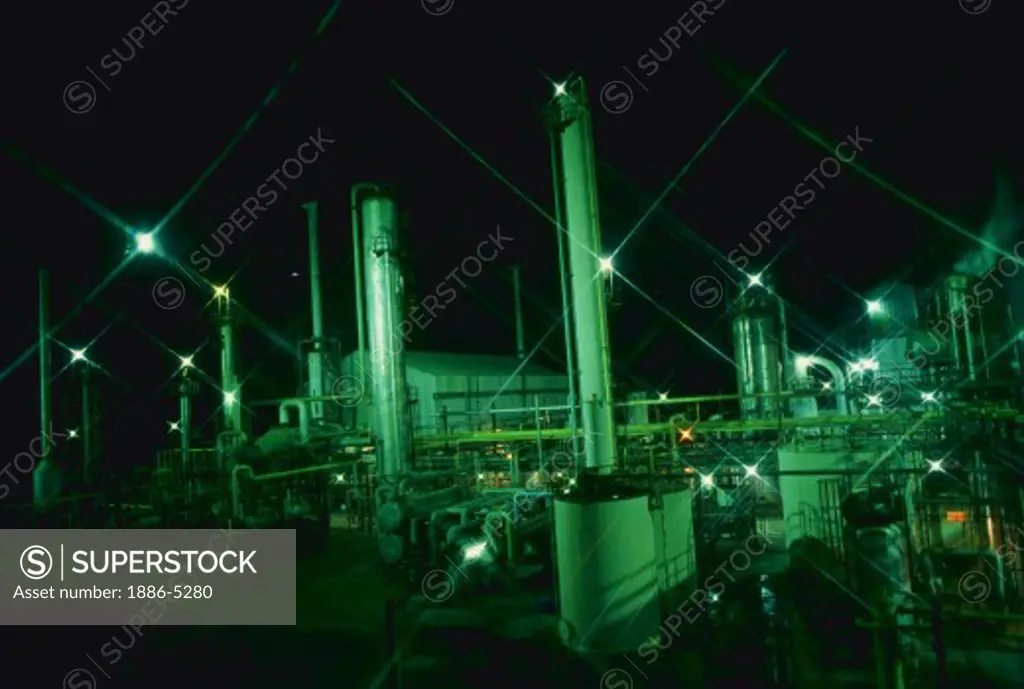 Oil refinery at night, with lights, India.