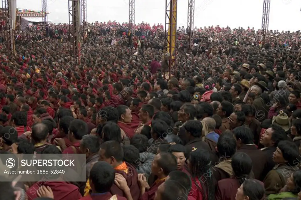 Crowd watches the dances at the  Monlam Chenmo masked dances, Katok Monastery - Kham, (Tibet), Sichuan, China
