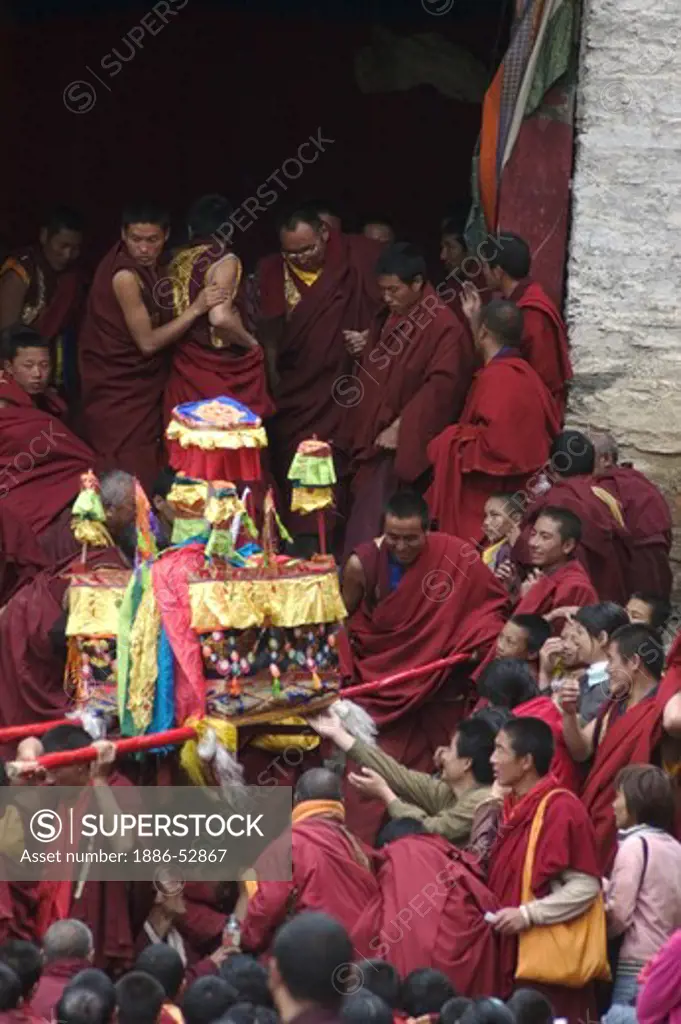 Buddhist monk with holy relics at the initiation following the Monlam Chenpo at Katok Monastery - Kham, (Tibet), China