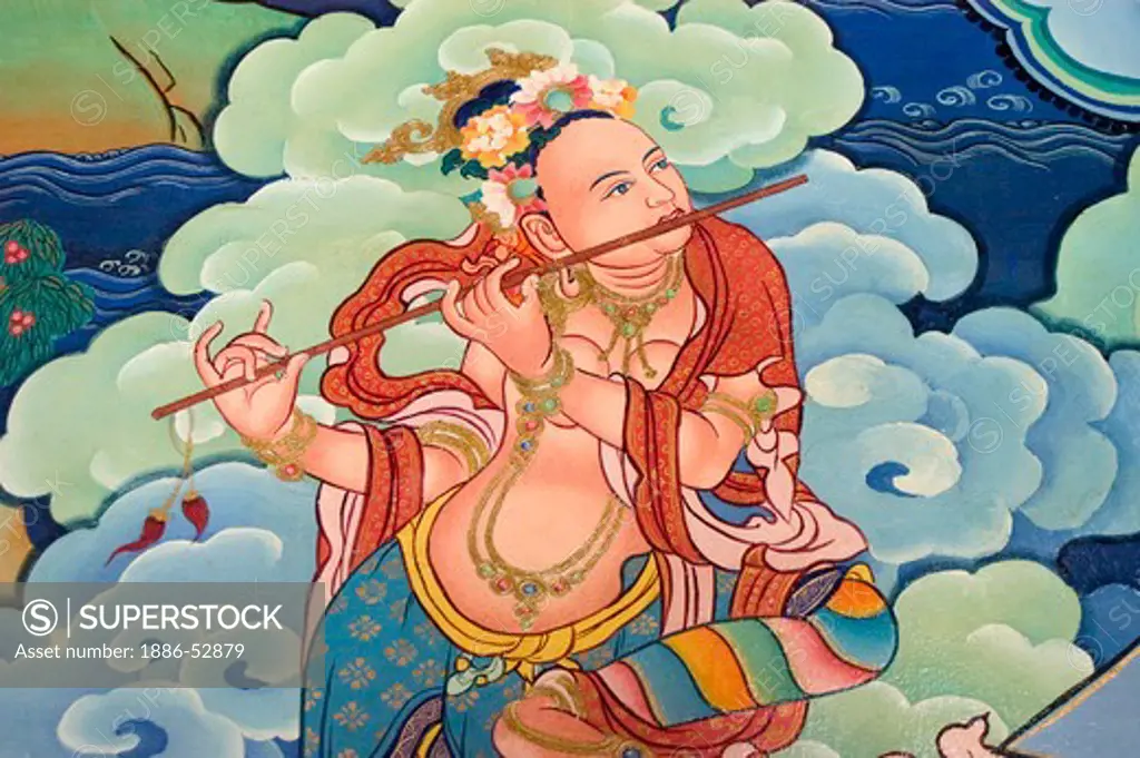 Flute playing Buddhist goddess or Sky Dancer, at the entrance to the Litang Chode Monastery, - Kham, Sichuan Province, China, (Tibet)